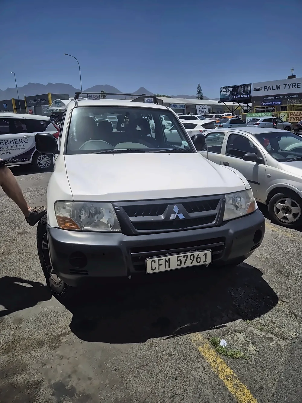 A customer's car parked in the yard at Muffler Inn